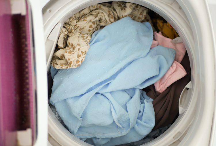 colorful cloths into washing machine